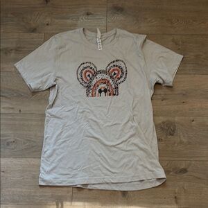 Women’s Beige Bella Canvas Disney World Shirt with Leopard Print.